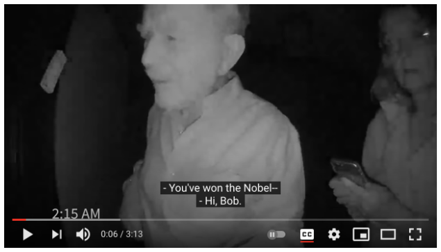 Screenshot of video with captions, “You’ve won the Nobel--Hi, Bob.” 
