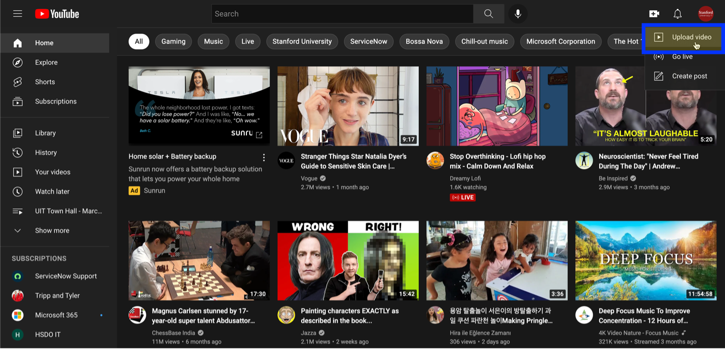 YouTube home page with upload video selected.