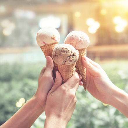 Hands holding ice cream cones