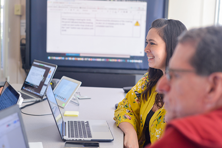 Several people video conferencing on campus