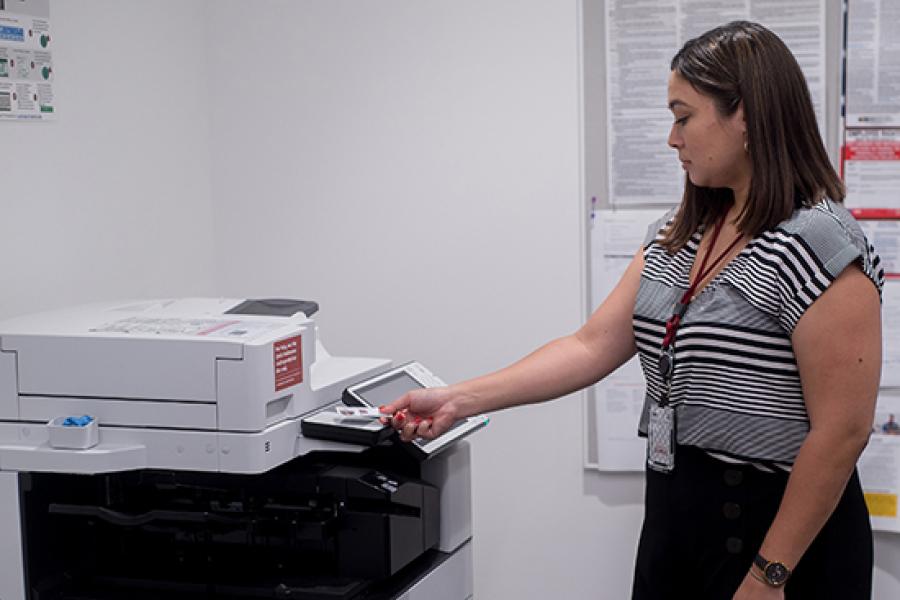 Image of staff member using a Cardinal Print device