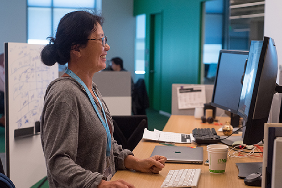 Woman working on desktop computer