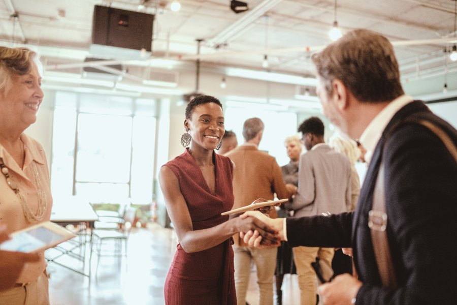 People shaking hands at an event