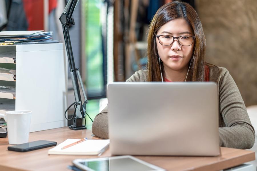 Image of a woman on her laptop