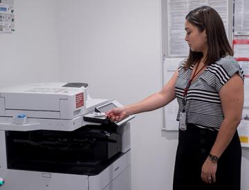 Image of staff member using a Cardinal Print device